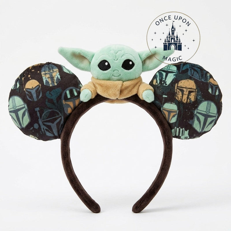 Once Upon Magic Grogu plush ear headband with Mandalorian helmet pattern on fuzzy ears. A fun Star Wars accessory.