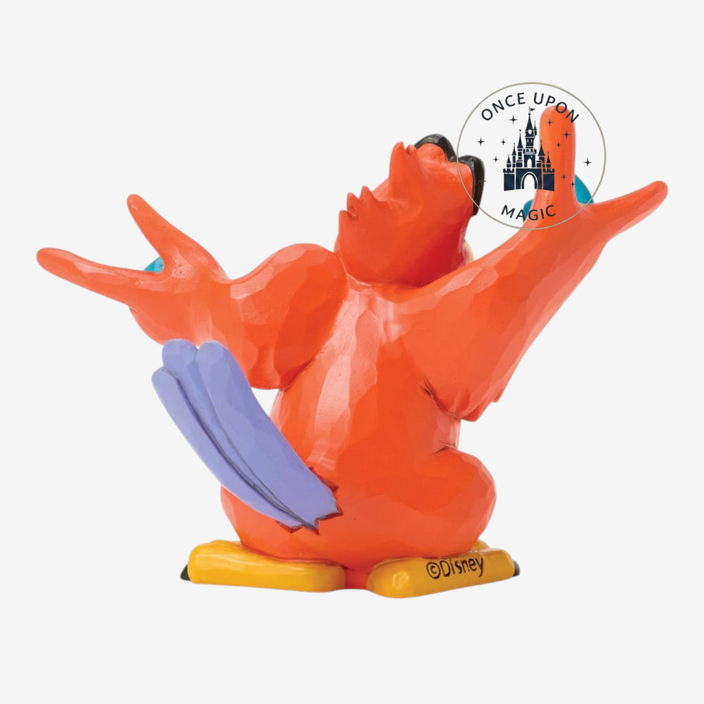 Détail du visage de la figurine Iago d’Aladdin