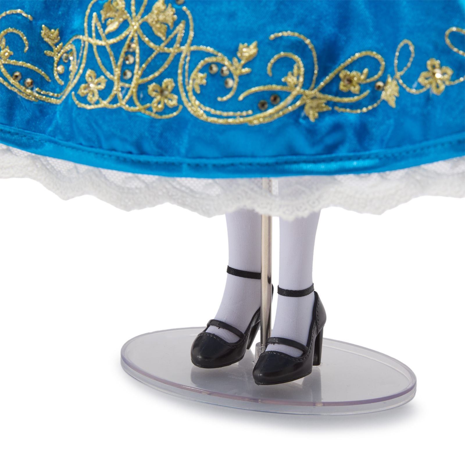 Broderies dorées, chaussures et présentoir de la poupée Alice
