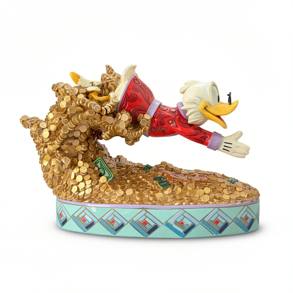 Figurine Picsou Disney Traditions plongeant dans un tas de pièces d’or – vue de face