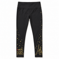 Legging Les Aristochats noir à étoiles dorées Disneyland Paris, vue de face sur fond blanc.