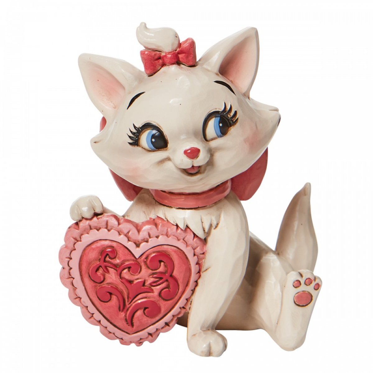Jim Shore Marie-figuur met roze hart en roze strik op het hoofd