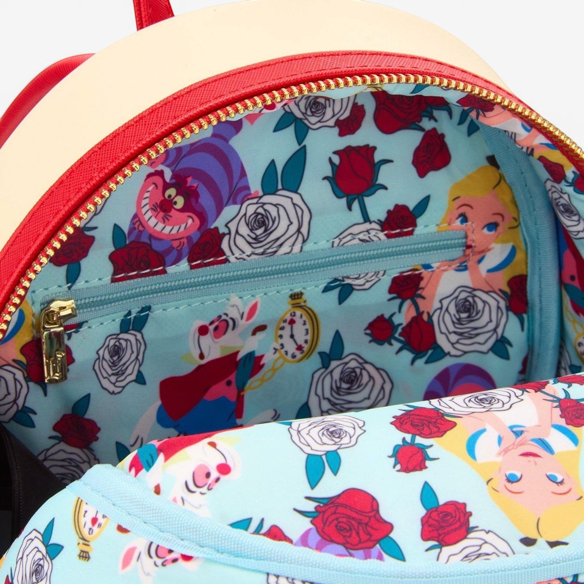 Once Upon Magic Alice in Wonderland mini backpack with Cheshire Cat, White Rabbit, and roses. UV reactive.