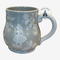 Once Upon Magic grey ceramic coffee mug with embossed Alice in Wonderland floral motifs and ergonomic handle.