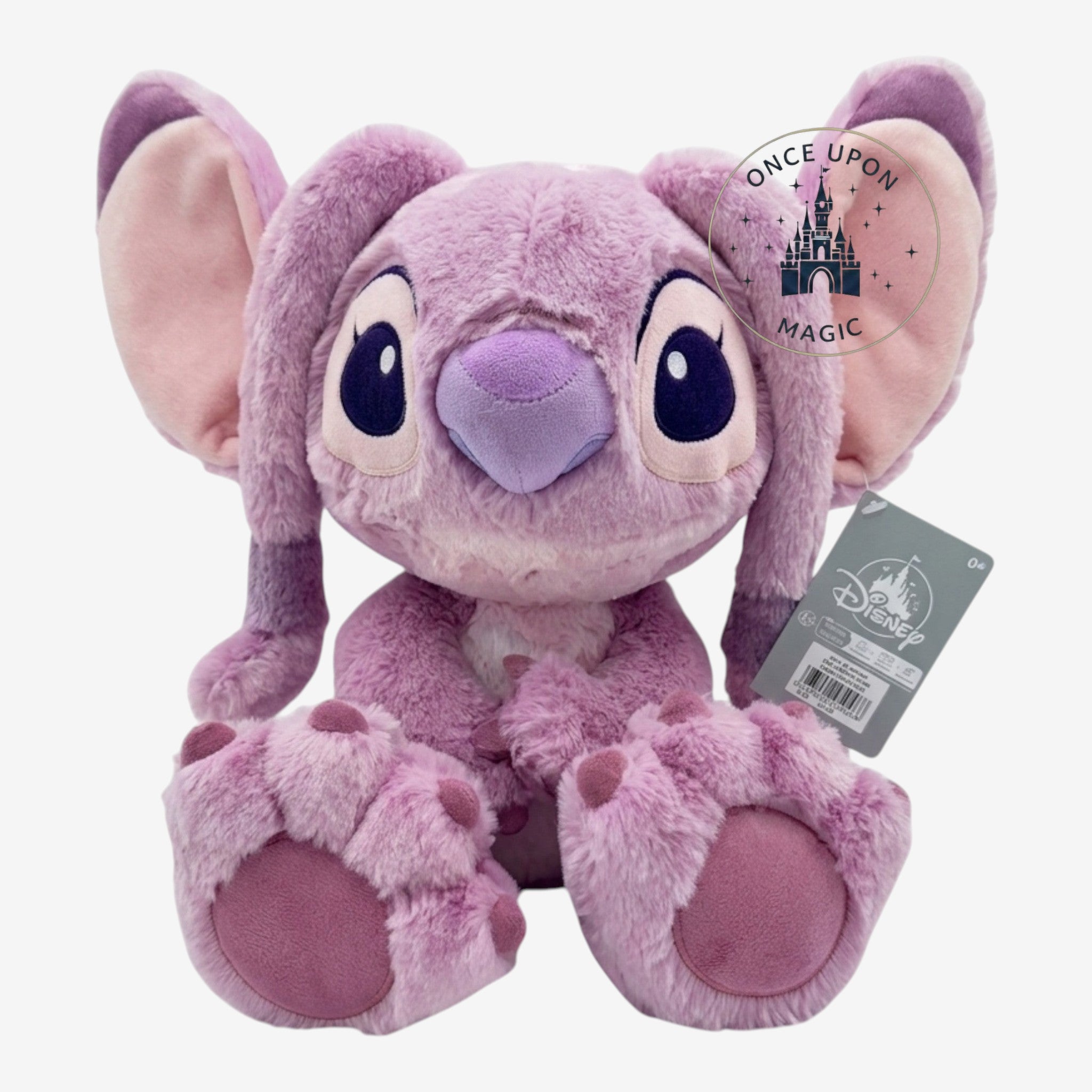 Once Upon Magic pink Angel Big Feet plush toy from Disneyland Paris, featuring large ears, antennae, and soft polyester material.