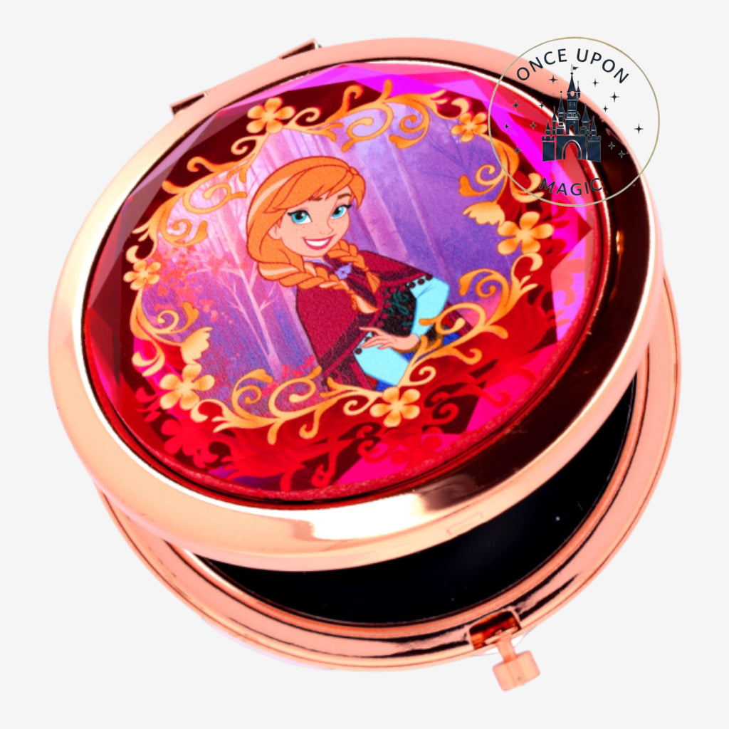 Once Upon Magic Anna compact mirror from Frozen, featuring Anna in a rose gold frame with floral accents.