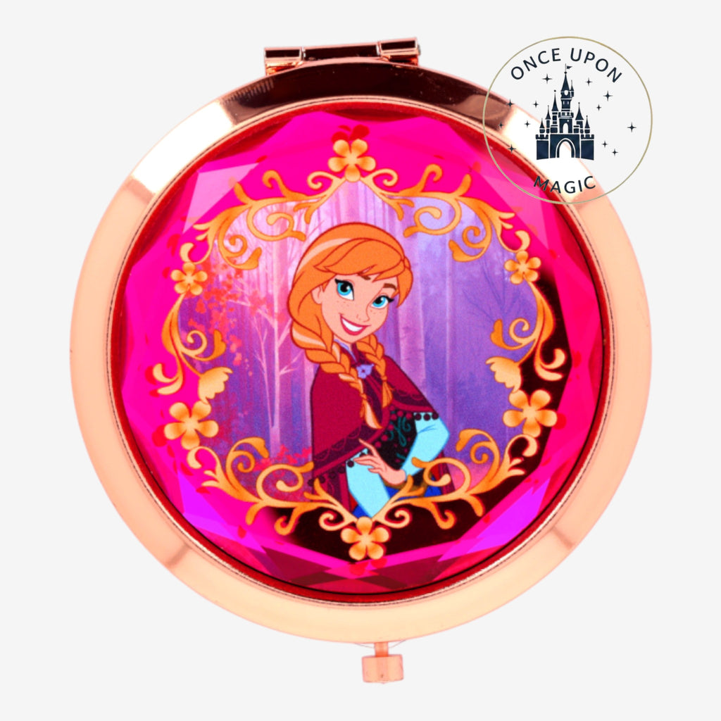 Once Upon Magic Anna compact mirror with pink gem border and Frozen forest scene. Rose gold finish.