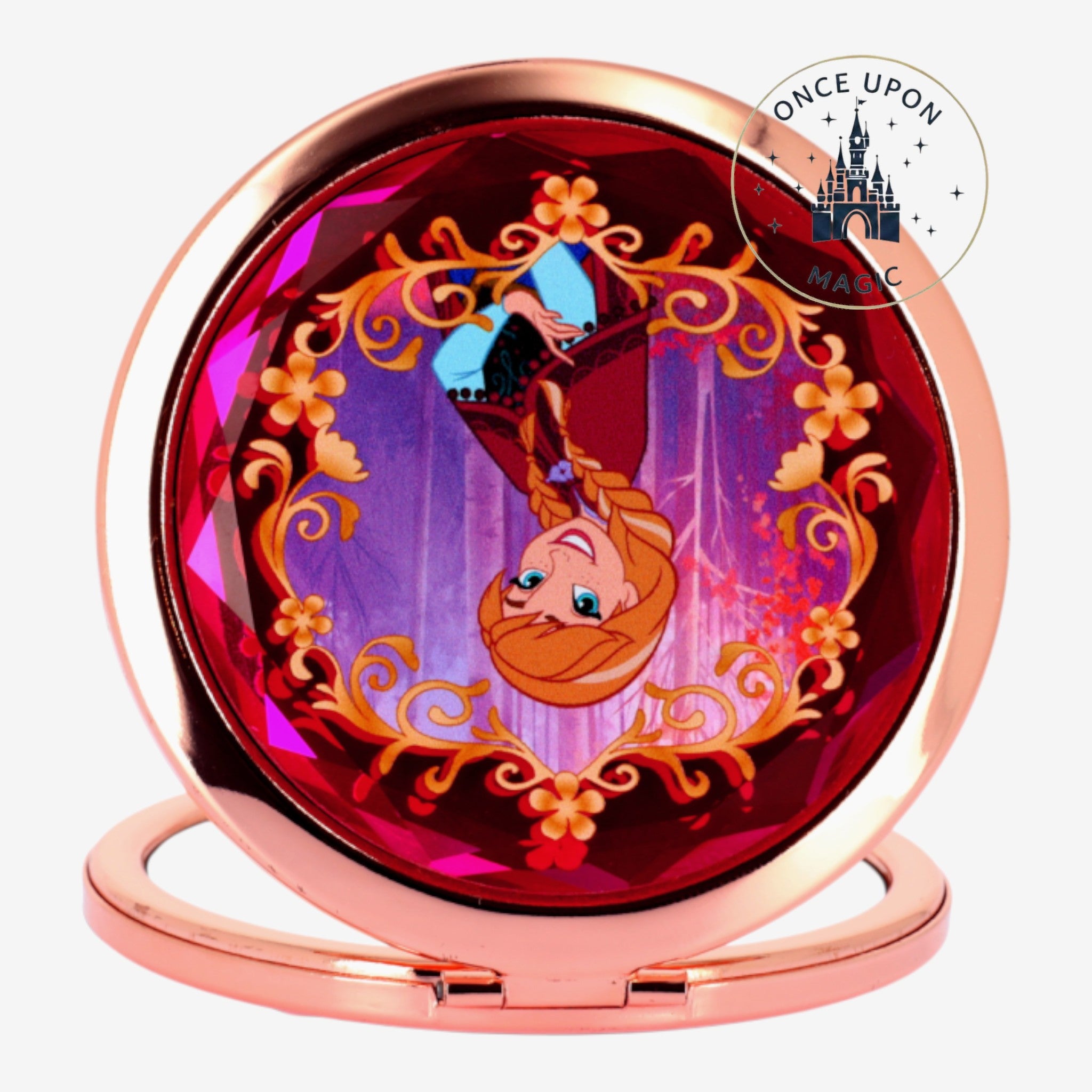 Once Upon Magic Anna compact mirror featuring a rose gold finish and a faceted red gem with a Frozen-themed illustration of Anna.