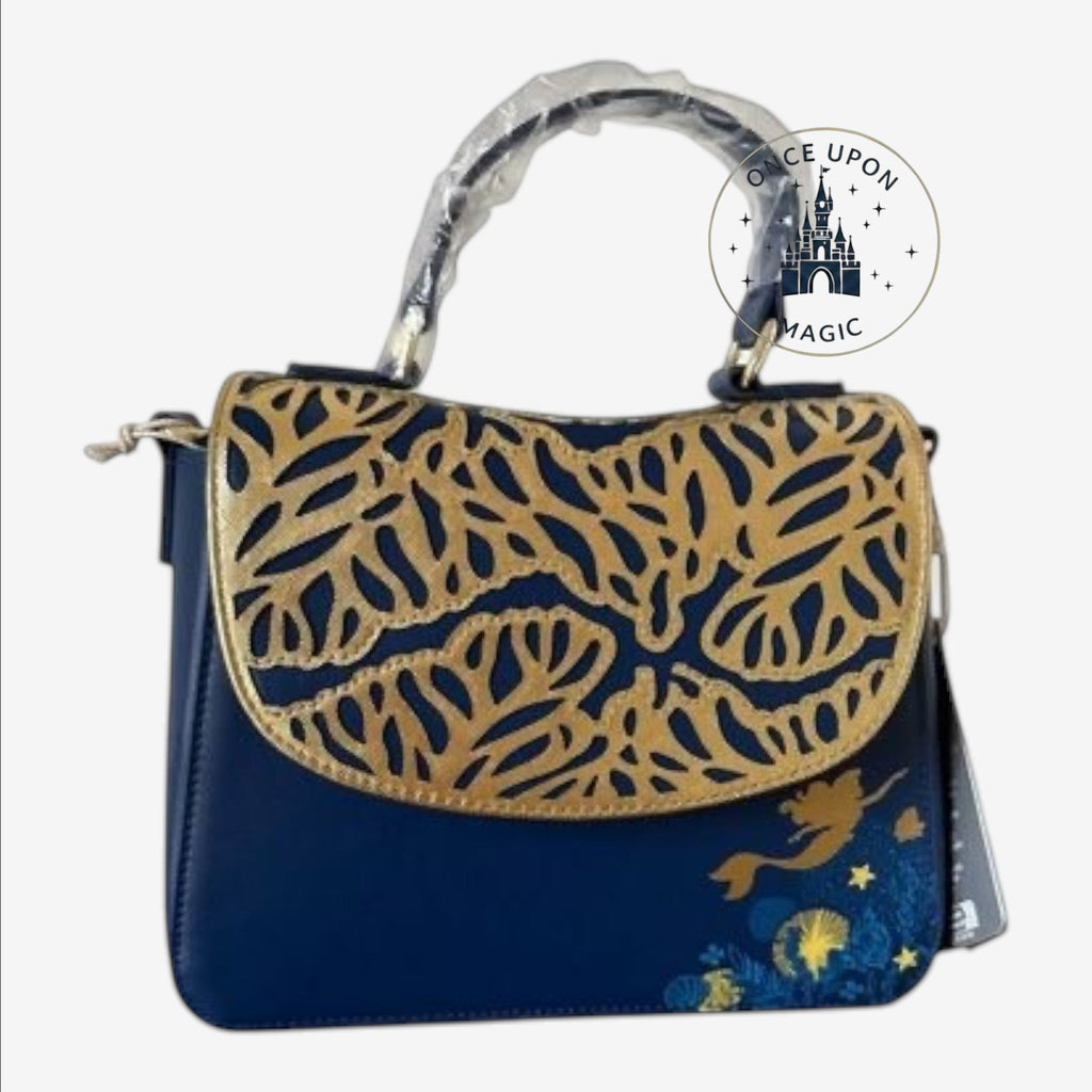 Once Upon Magic dark blue faux leather crossbody bag with gold coral cutouts on the flap and Ariel graphic on the lower front.