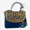 Once Upon Magic dark blue faux leather crossbody bag with gold coral cutouts on the flap and Ariel graphic on the lower front.