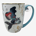 Once Upon Magic Ariel ceramic mug with gold seaweed motifs, turquoise handle, and Little Mermaid silhouette design.