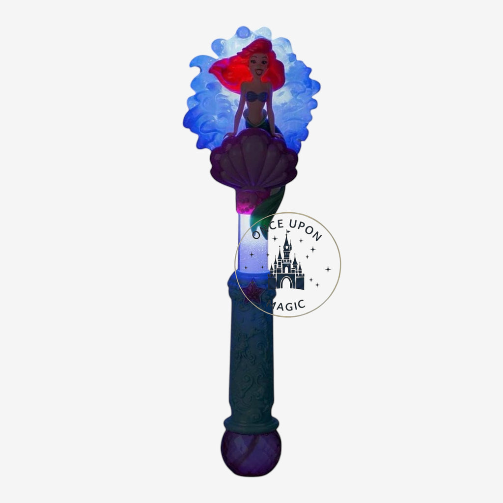 Once Upon Magic Ariel character wand featuring a red-haired mermaid figure on a purple seashell with a blue handle