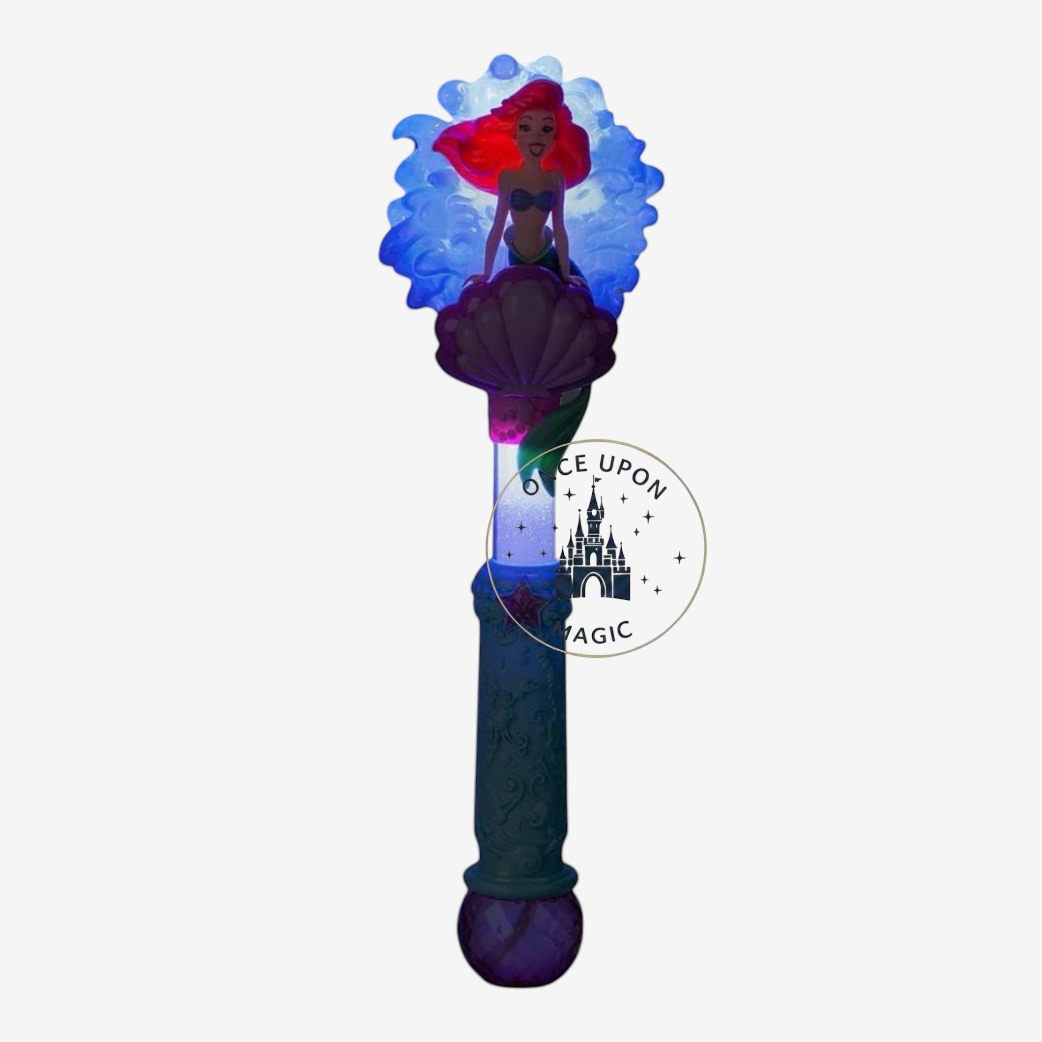 Once Upon Magic Ariel character wand featuring a red-haired mermaid figure on a purple seashell with a blue handle