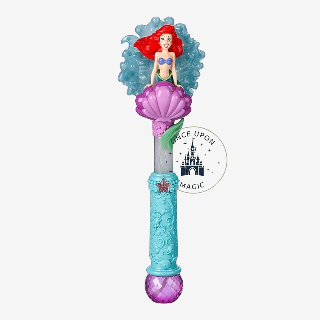Once Upon Magic Ariel character wand featuring a mermaid figure on a purple seashell with a textured blue handle.