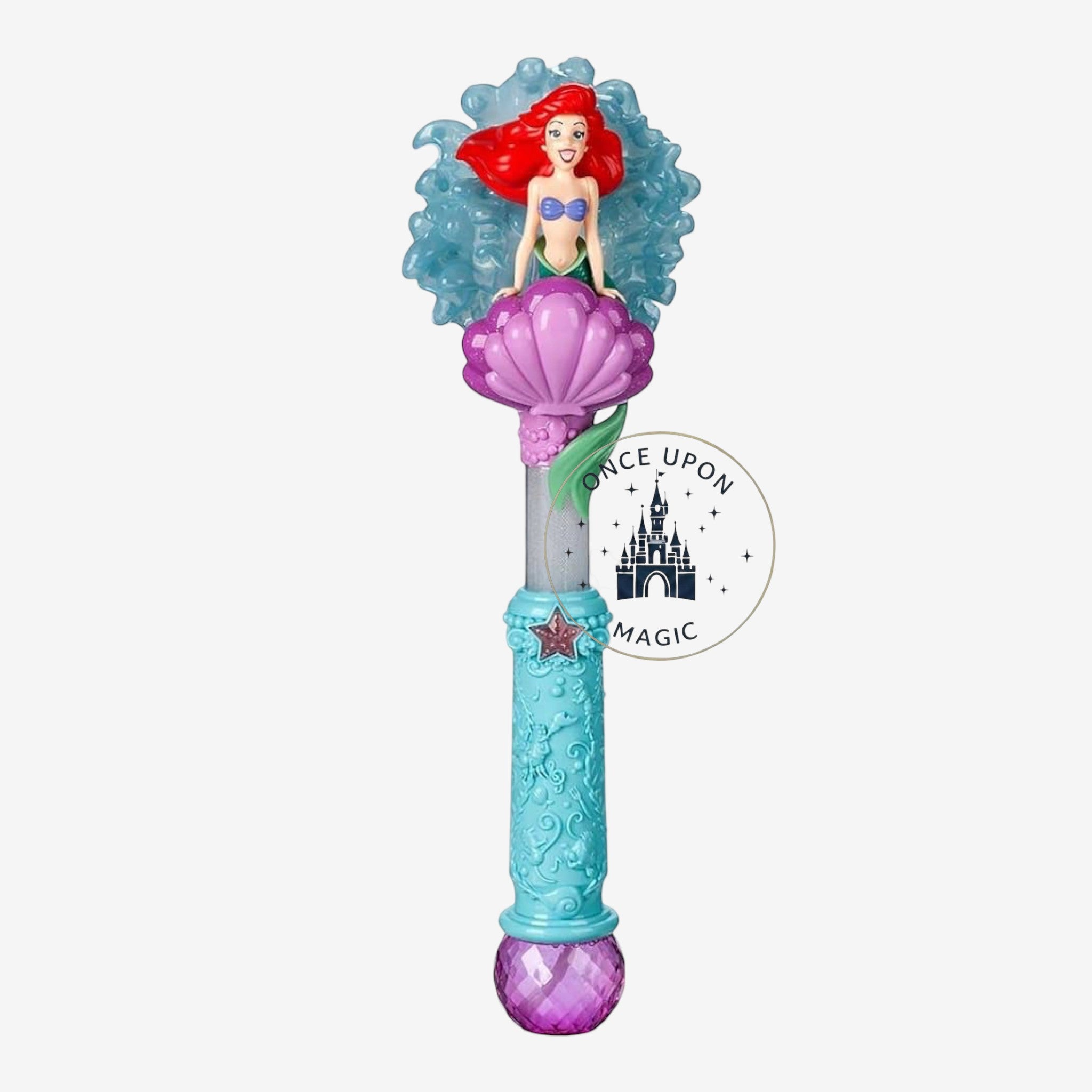 Once Upon Magic Ariel character wand featuring a mermaid figure on a purple seashell with a textured blue handle.