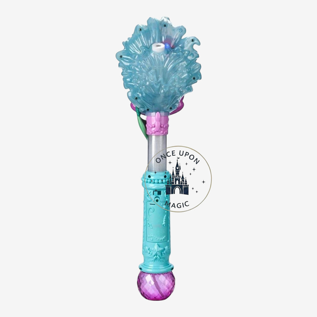 Once Upon Magic Ariel character wand featuring a blue wave-textured handle, purple seashell, and jewel-toned base.