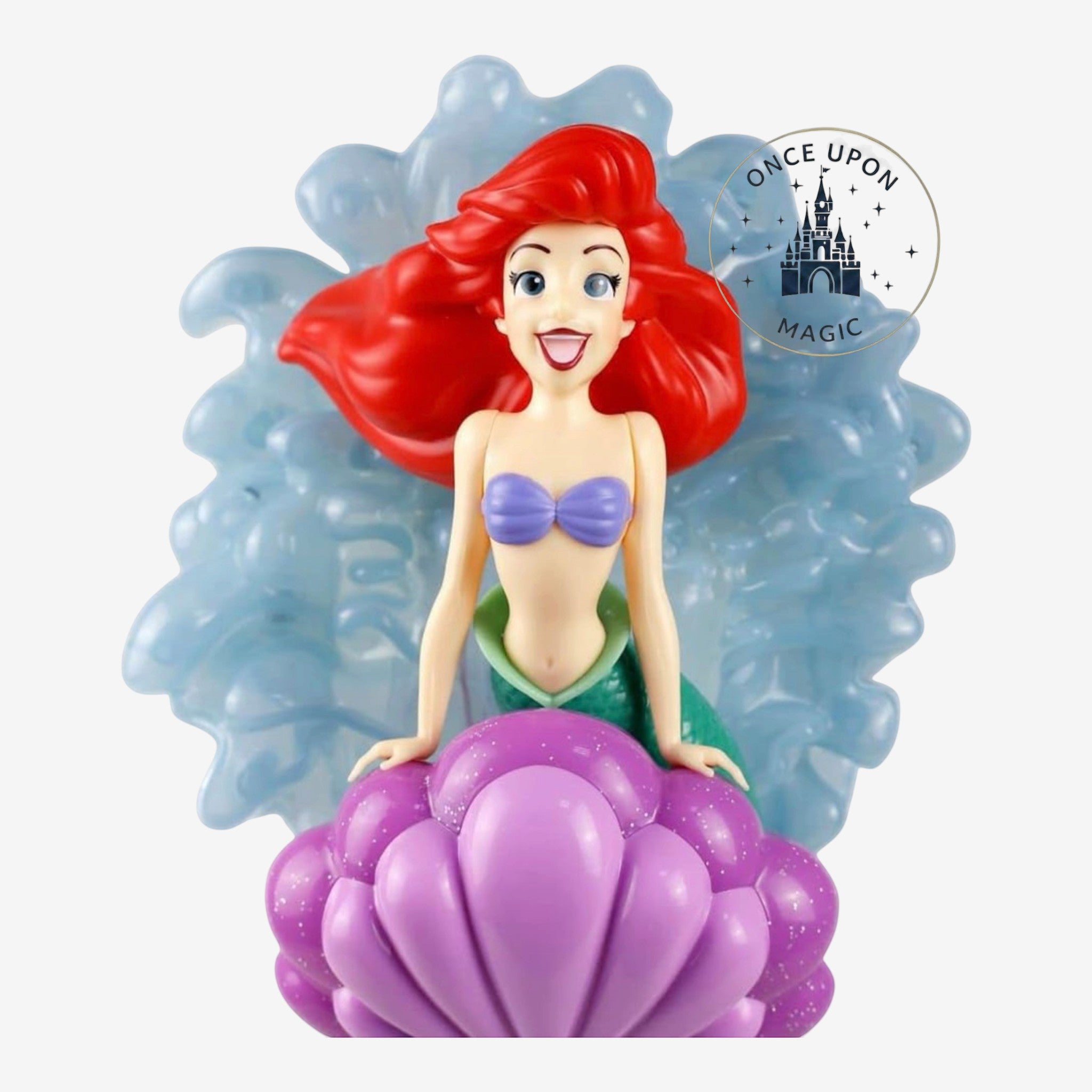 Once Upon Magic Ariel character wand featuring a detailed mermaid figure on a sparkling purple seashell base