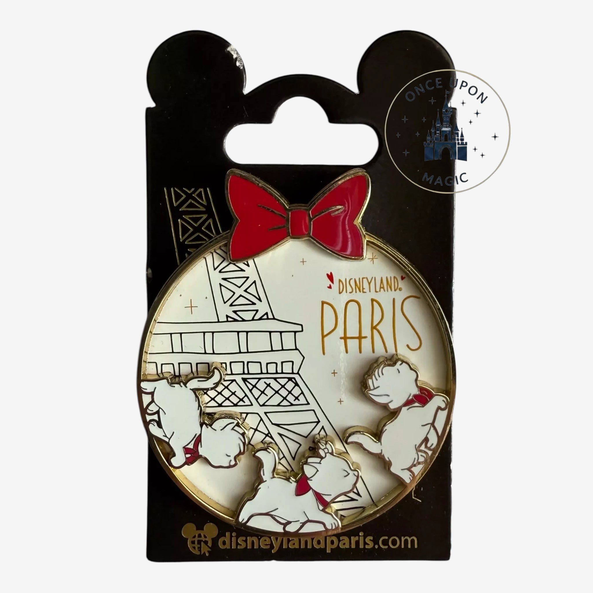 Once Upon Magic Aristocats enamel pin featuring Marie, Toulouse, and Berlioz with an Eiffel Tower and red bow.