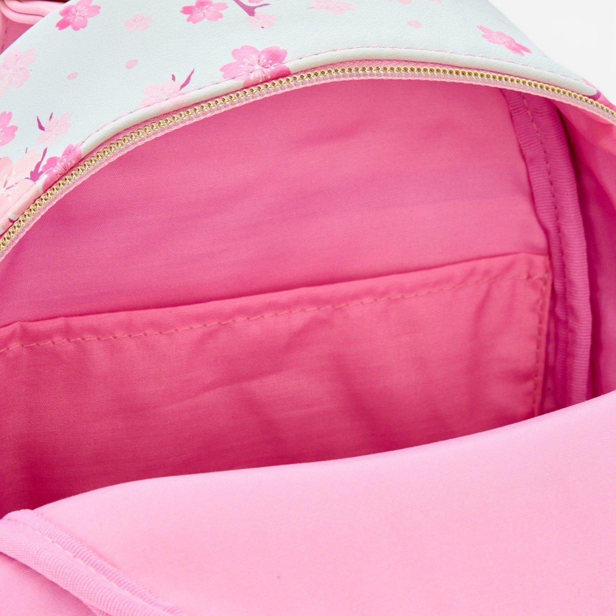 Once Upon Magic mini backpack with Marie, Toulouse & Berlioz from The Aristocats on a cherry blossom print. Pink interior.