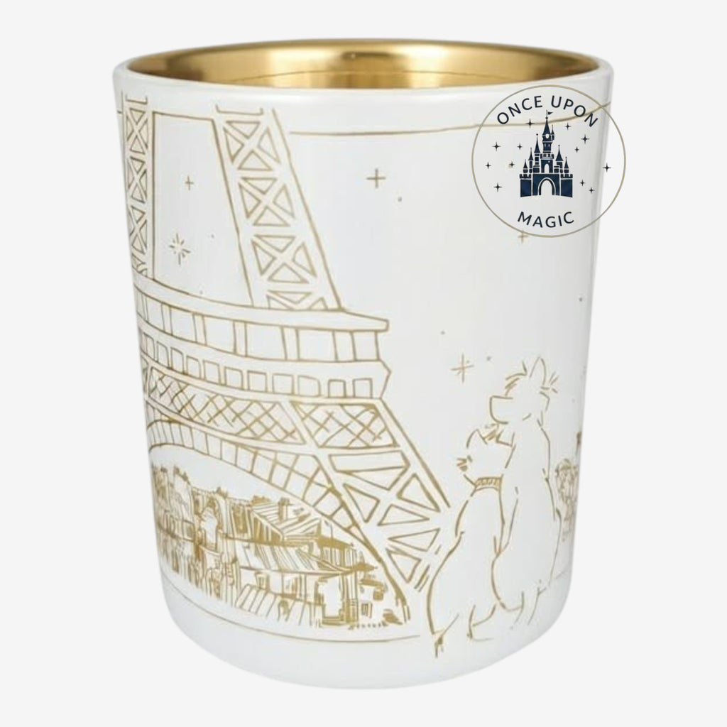 Once Upon Magic white ceramic photophore with gold Aristocats characters and Eiffel Tower design. Interior is gold.