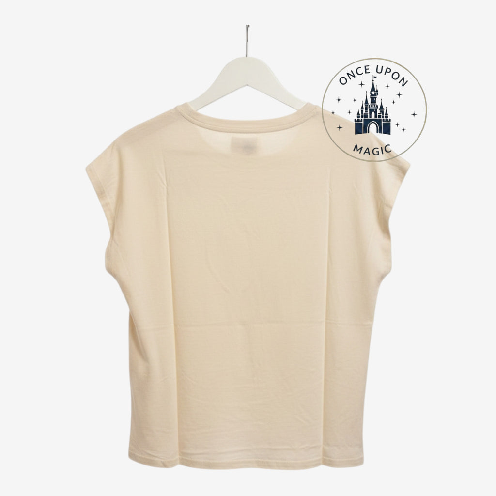 Once Upon Magic beige ecru Minnie Mouse t-shirt back view hanging on a white hanger