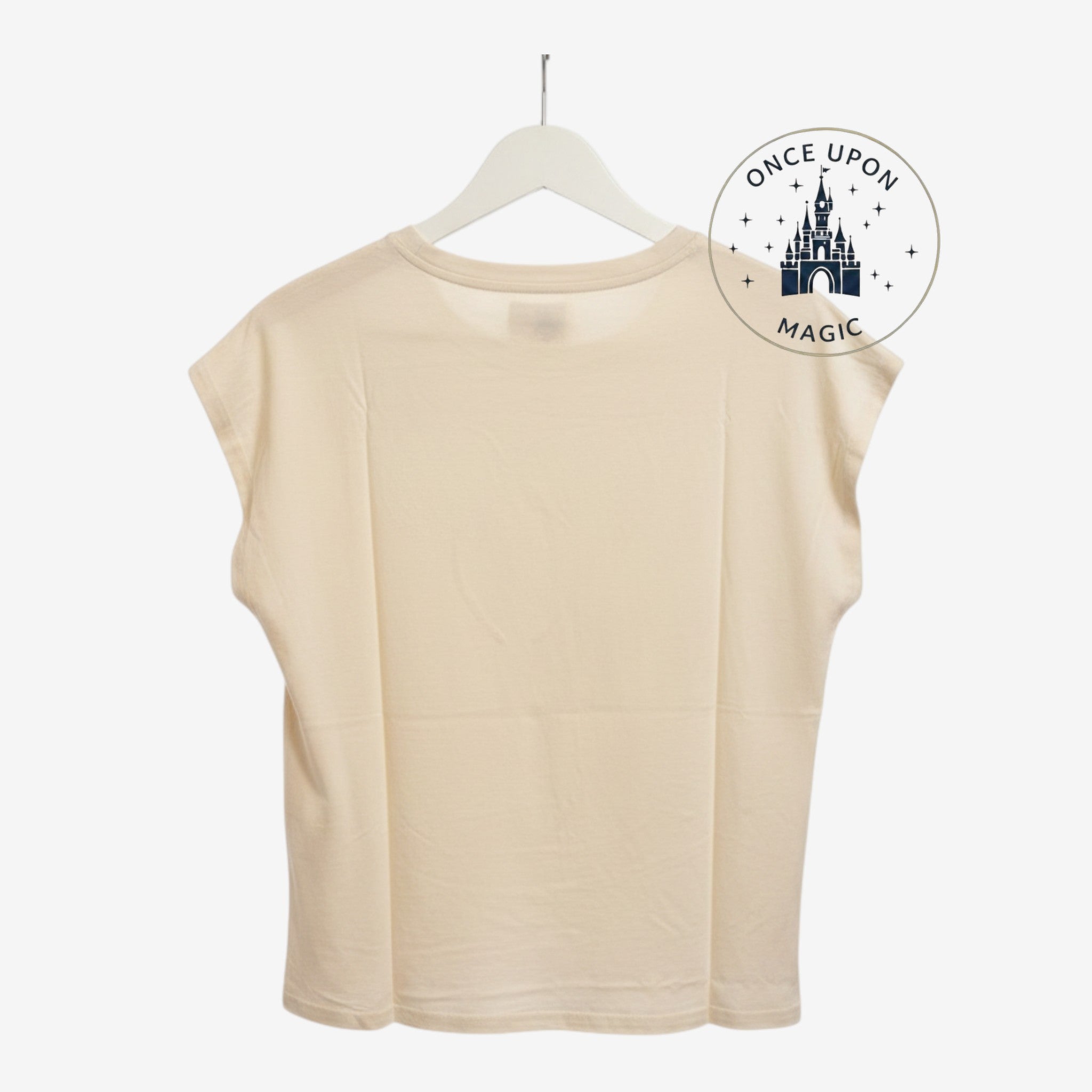 Once Upon Magic beige ecru Minnie Mouse t-shirt back view hanging on a white hanger