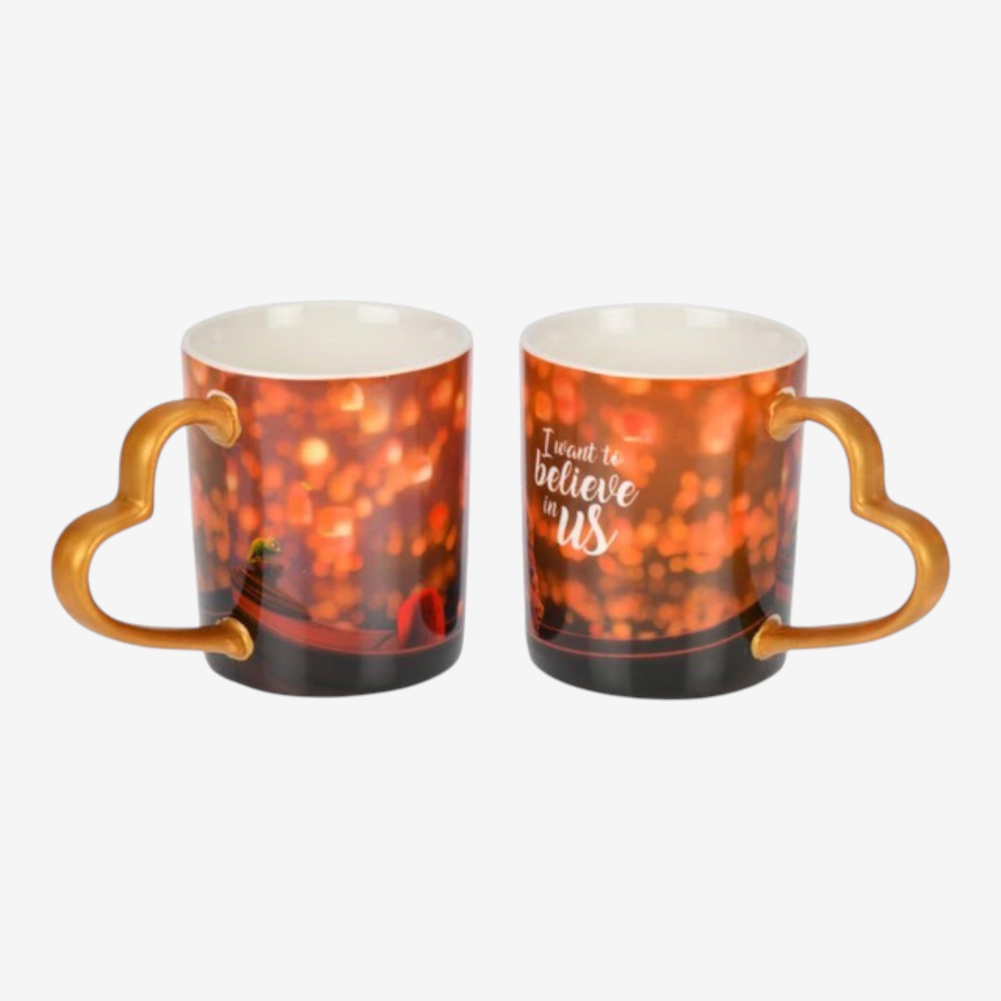 Once Upon Magic ceramic mug with heart-shaped handle, featuring a bokeh light design and "I want to believe in us" quote.