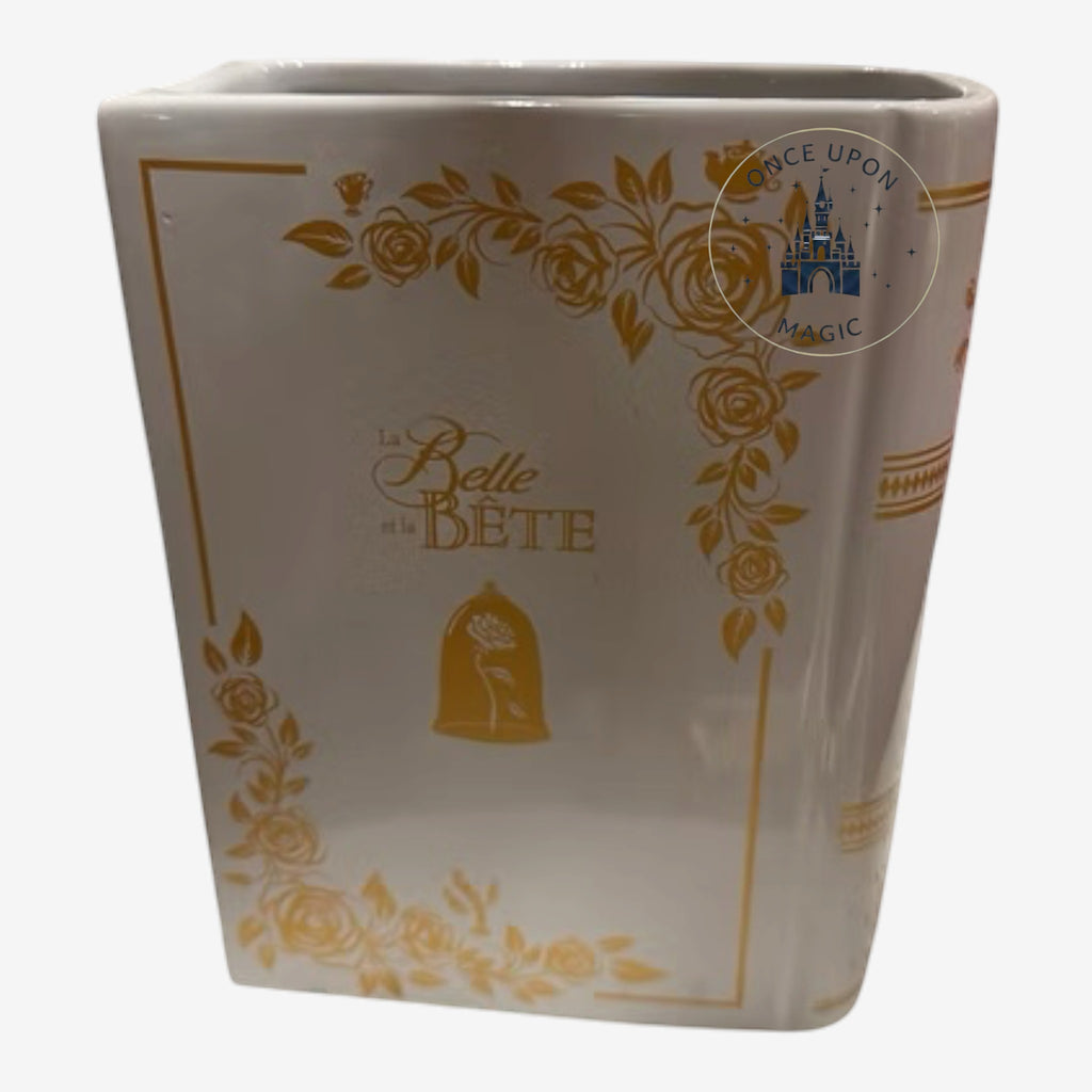 Once Upon Magic Belle vase from Beauty and the Beast featuring gold rose illustrations on a white ceramic surface