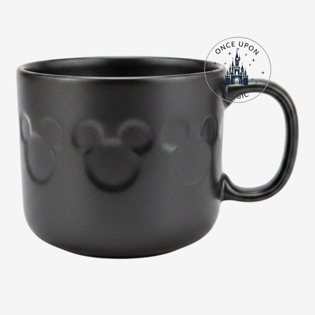 Once Upon Magic black Disneyland Paris mug featuring a subtle embossed Mickey Mouse icon pattern