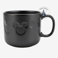 Once Upon Magic black Disneyland Paris mug featuring a subtle embossed Mickey Mouse icon pattern