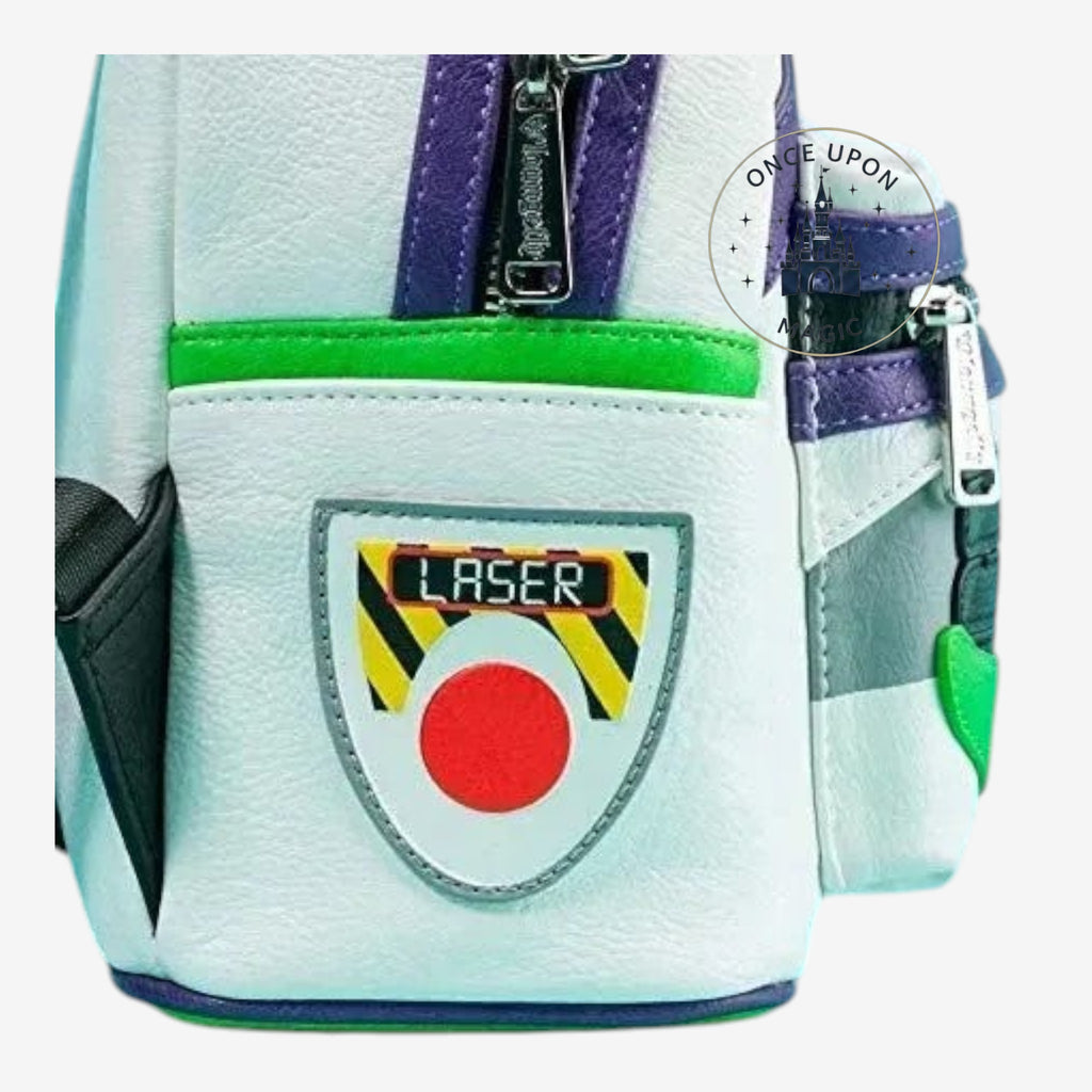 Once Upon Magic Buzz Lightyear Space Ranger backpack in white faux leather with green, purple, and black accents. Features a laser emblem.