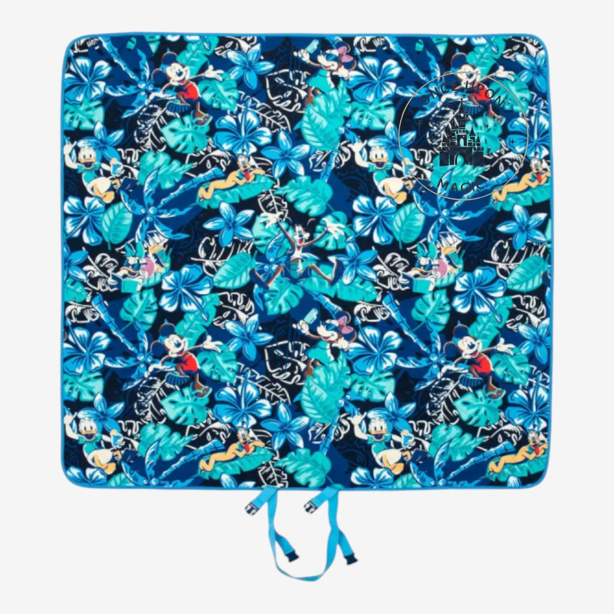 Once Upon Magic picnic blanket featuring a blue tropical floral print with classic character motifs and quilted texture.