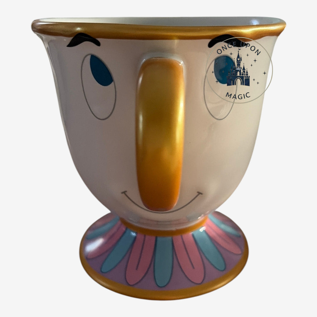 Once Upon Magic ceramic Chip mug from Beauty and the Beast with blue eyes, gold handle, and floral base.