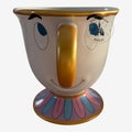 Once Upon Magic ceramic Chip mug from Beauty and the Beast with blue eyes, gold handle, and floral base.
