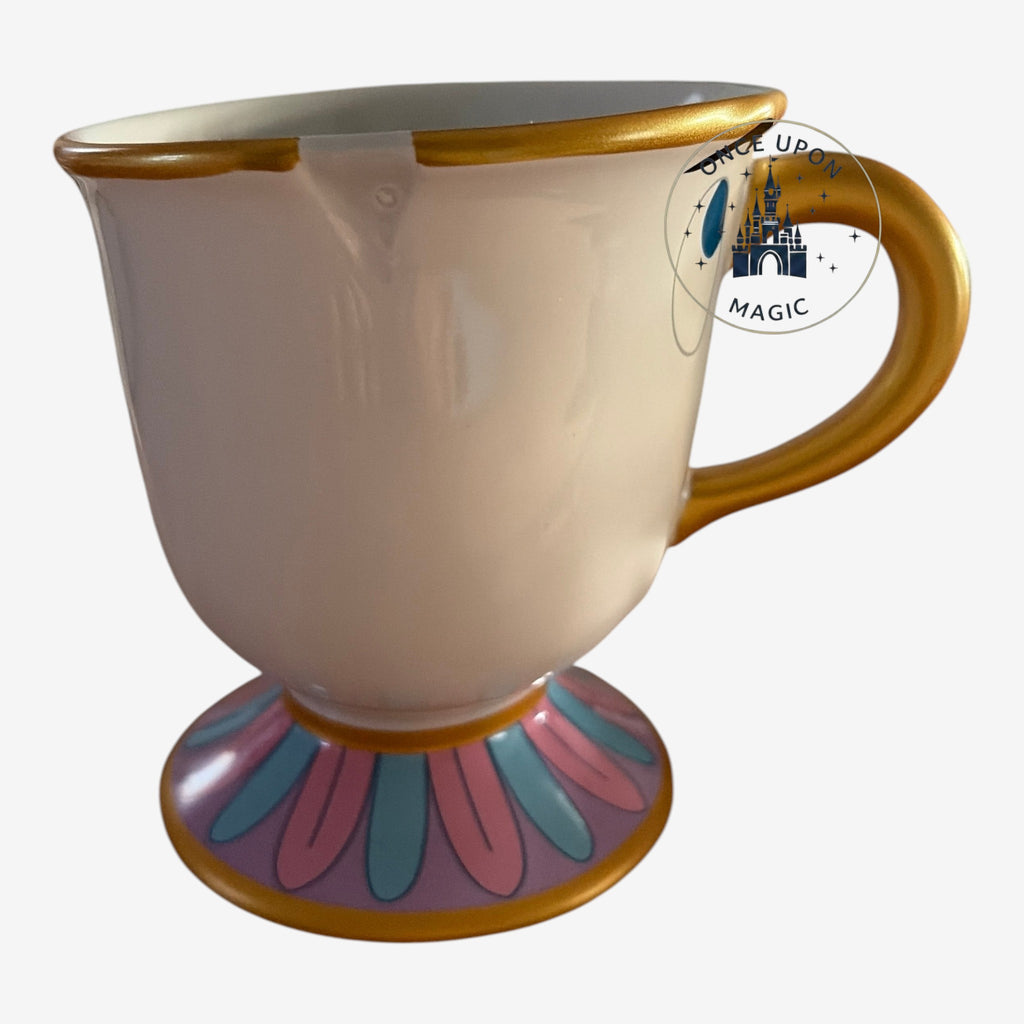Once Upon Magic ceramic Chip mug from Beauty and the Beast with gold handle, rim, and floral base detail.