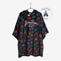 Once Upon Magic black fleece poncho with hooded design and colorful Disney Adventure World park emblems pattern.