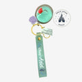 Once Upon Magic Disney Ariel keychain with planet charm filled with sea-green liquid, glitter, and Ariel figure. Seafoam green strap with Disney Ariel script.