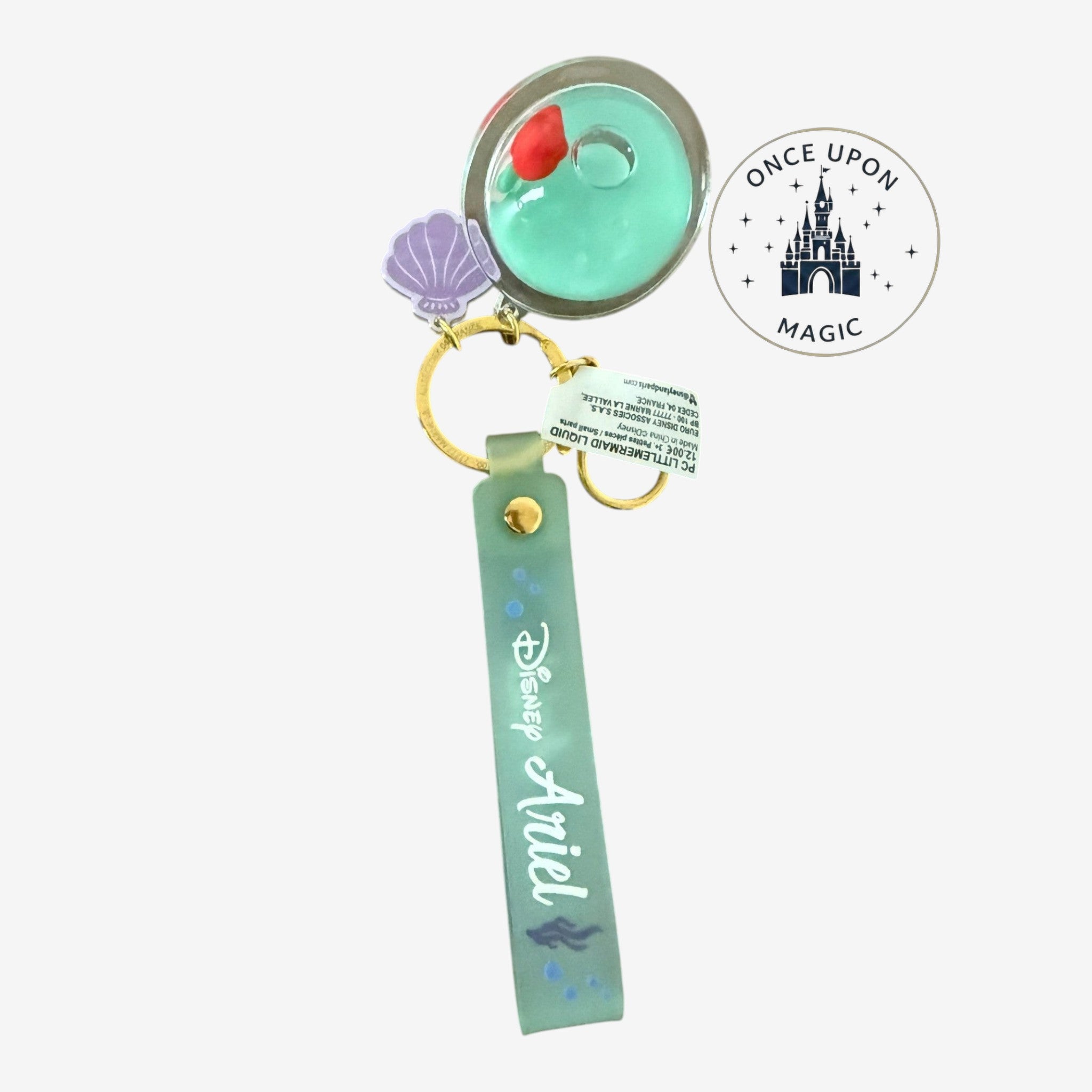 Once Upon Magic Disney Ariel keychain with planet charm filled with sea-green liquid, glitter, and Ariel figure. Seafoam green strap with Disney Ariel script.