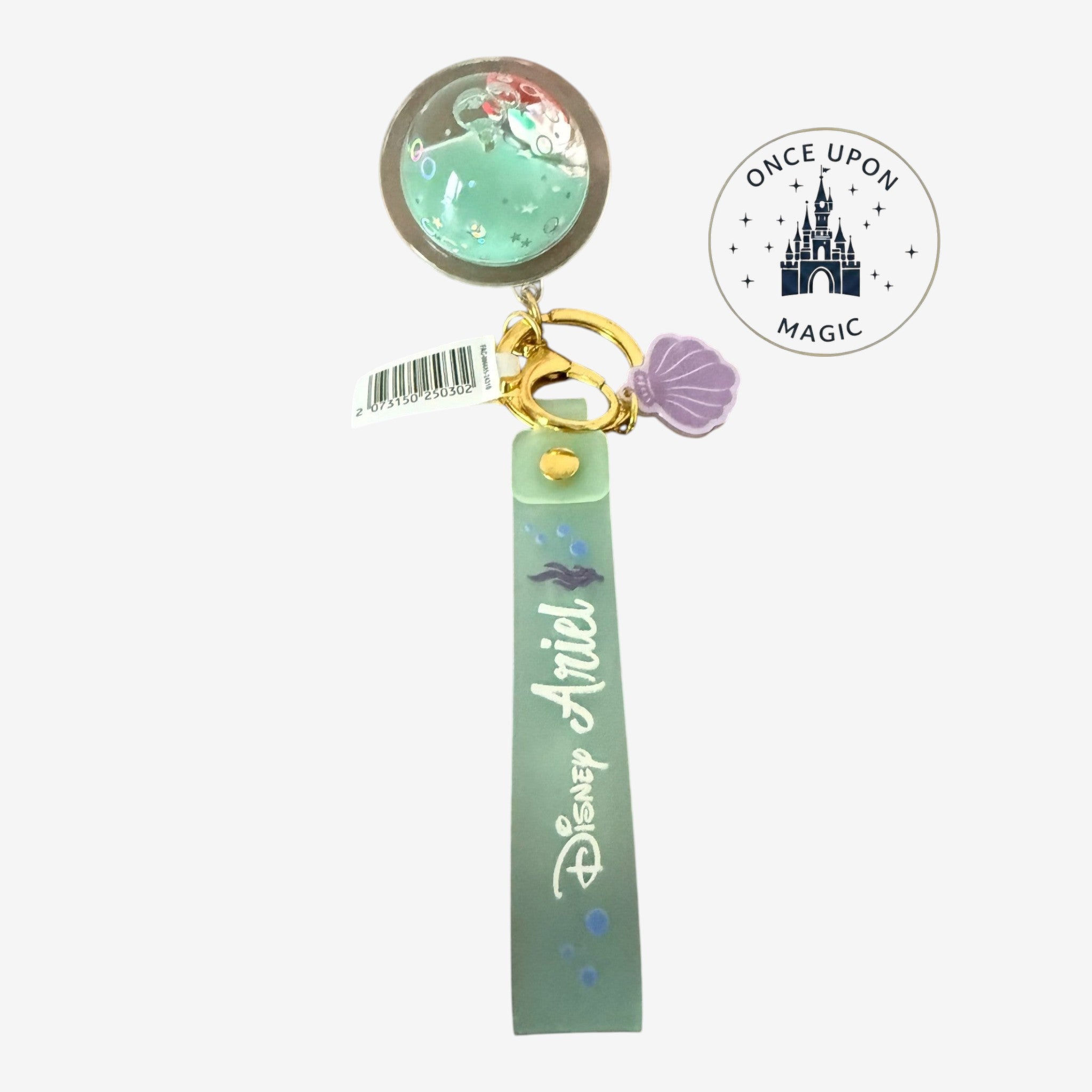 Once Upon Magic Disney Ariel keychain with a planet charm filled with sea-green liquid, glitter, and Ariel figure. Seafoam-green strap with Disney Ariel script.