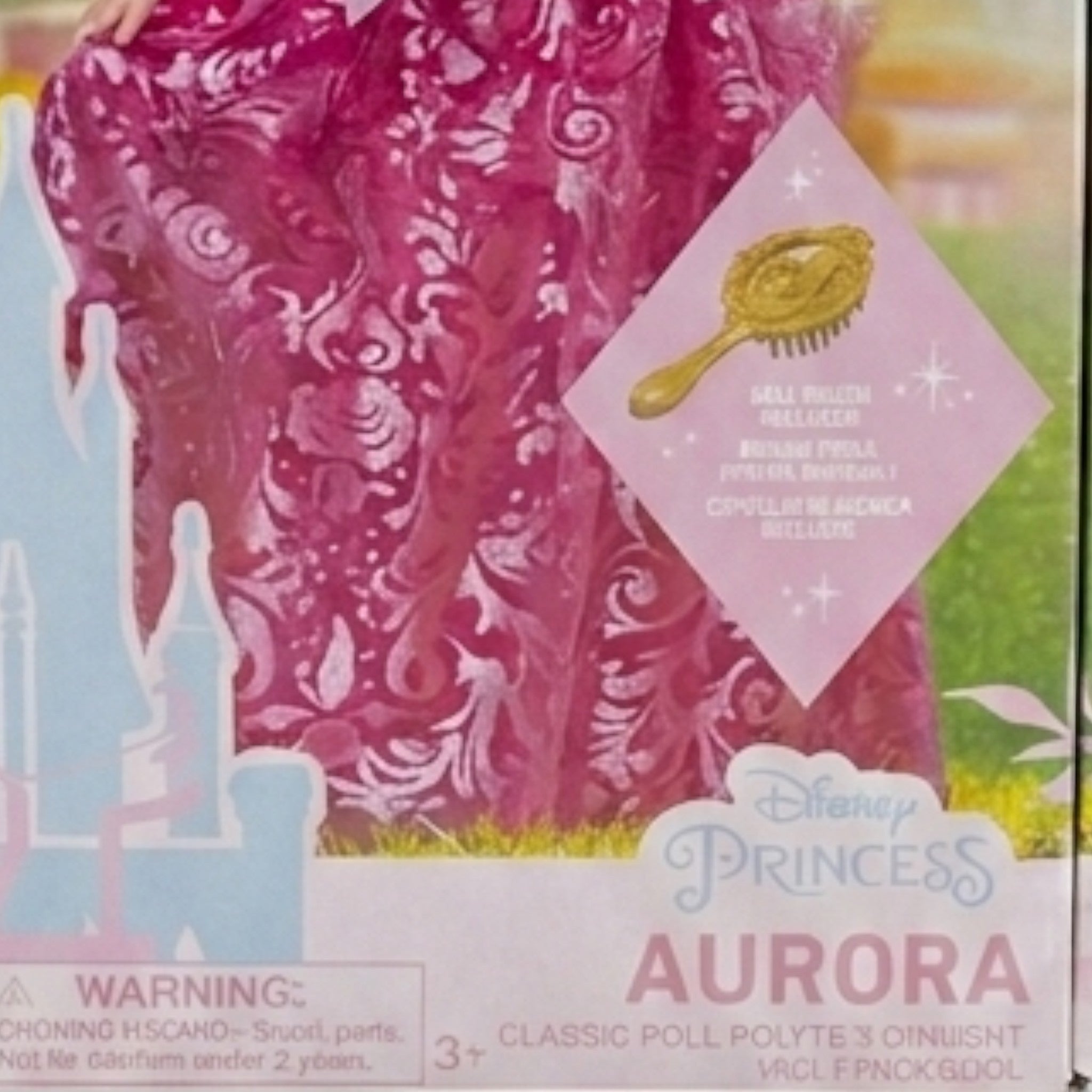 Once Upon Magic Disney Princess Aurora doll in a shimmering pink gown with floral patterns and a golden crown. Includes a golden brush.