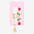 Once Upon Magic Disney La Belle et la Bête Belle rose claw hair clip with dangling enchanted rose and Belle charm.