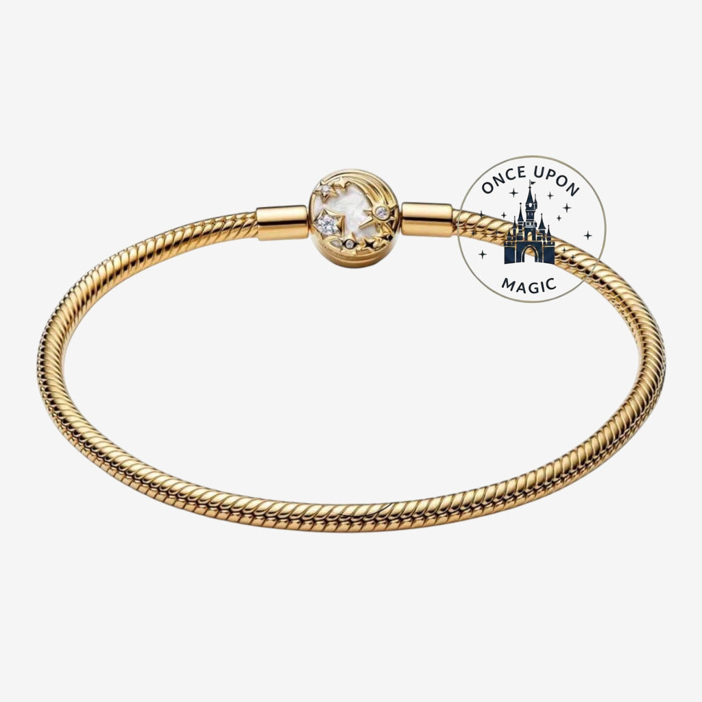 Once Upon Magic gold-tone bracelet with a charm featuring a castle and shooting stars, inspired by Disneyland Paris.
