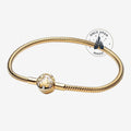 Once Upon Magic gold-tone bracelet with a charm featuring a castle silhouette and stars, inspired by Disneyland Paris.