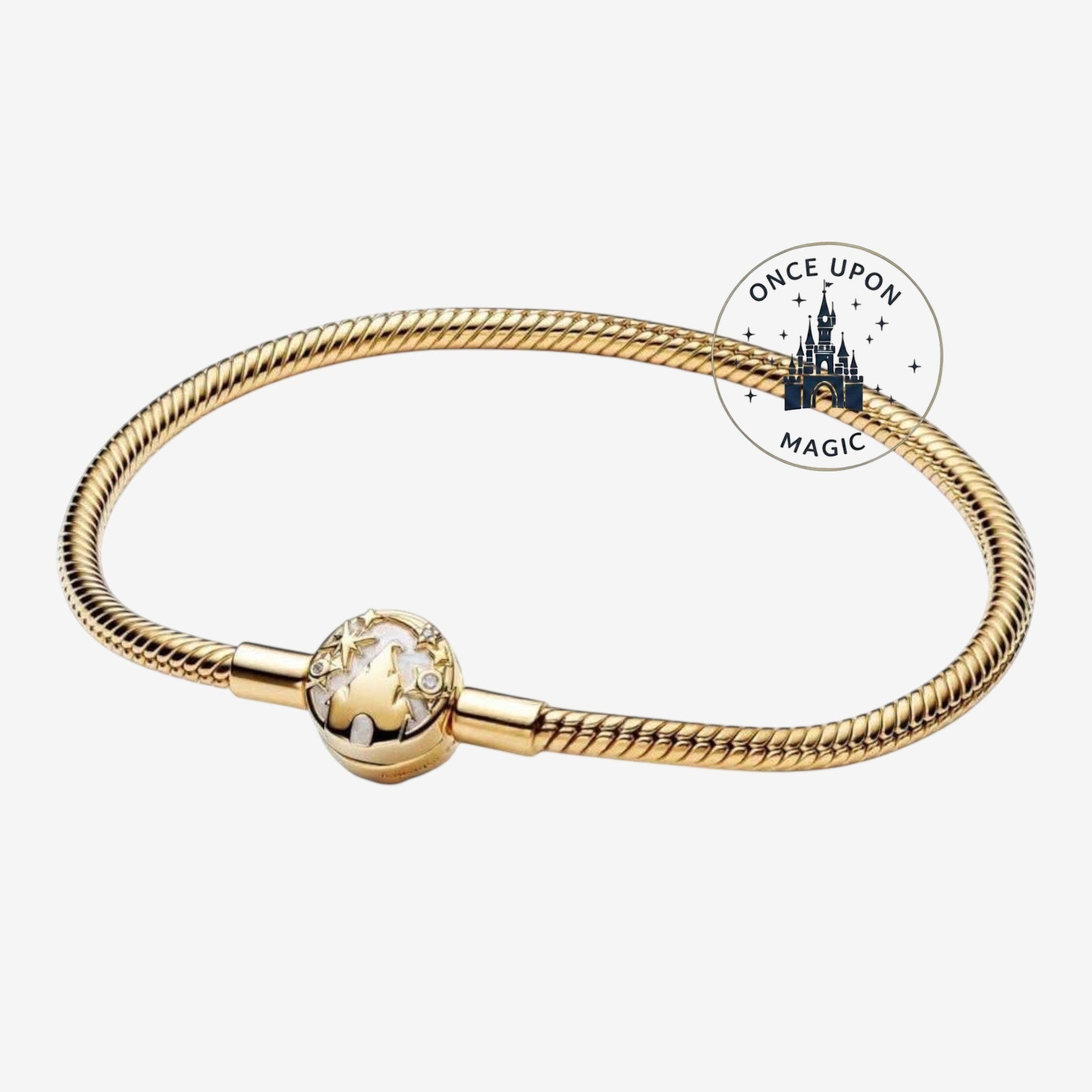 Once Upon Magic gold-tone bracelet with a charm featuring a castle silhouette and stars, inspired by Disneyland Paris.