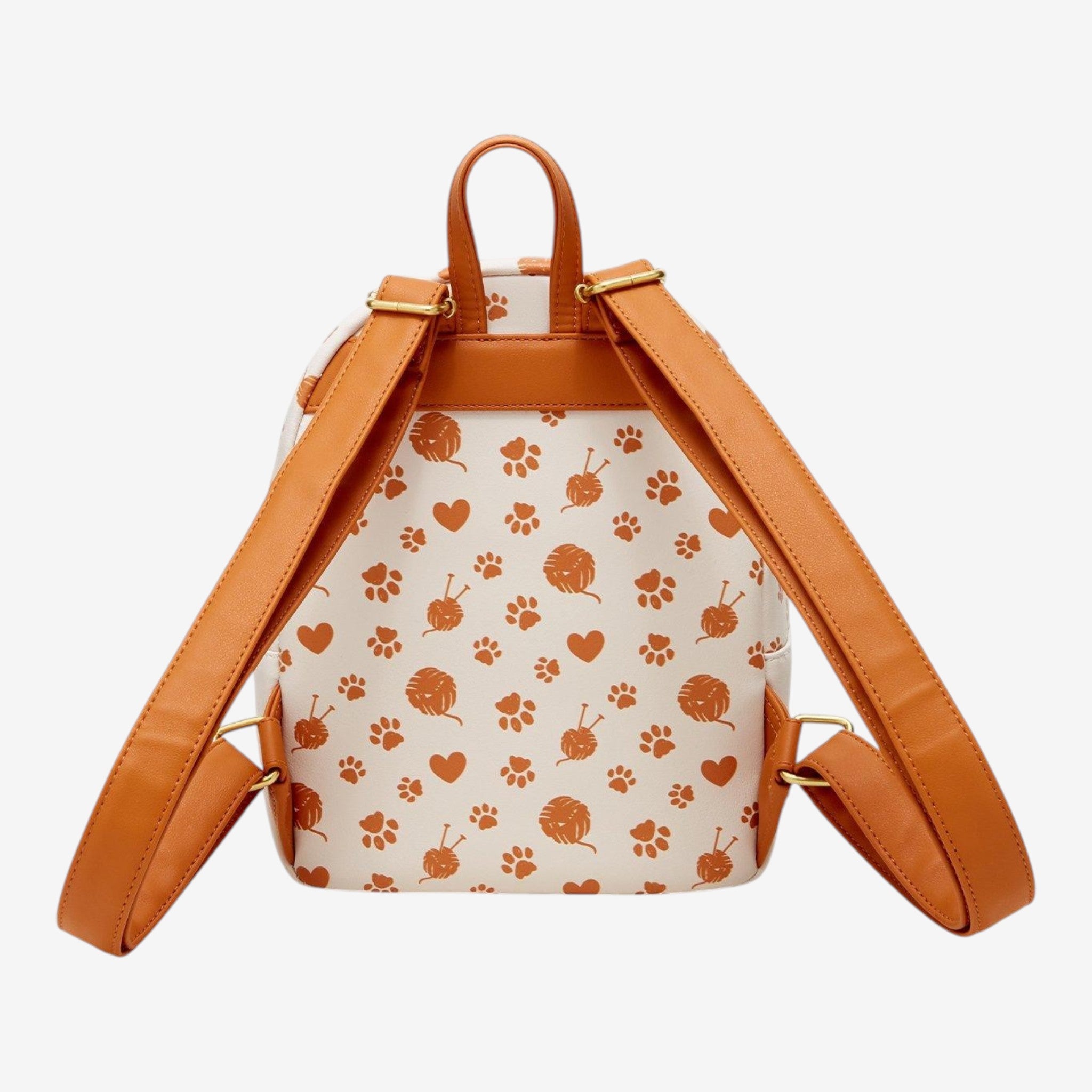 Once Upon Magic Disney cats mini backpack with yarn balls, paw prints, and hearts pattern on cream faux leather with tan straps.