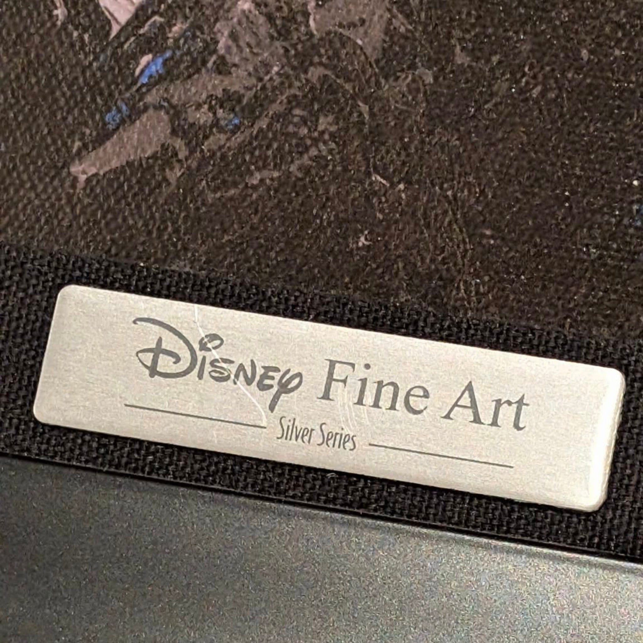 Once Upon Magic Disney Fine Art Silver Series metal plaque on a textured black framed canvas wall art