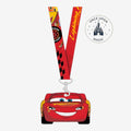 Once Upon Magic red lanyard with Lightning McQueen graphic and attached car-shaped pouch, Disneyland Paris souvenir.