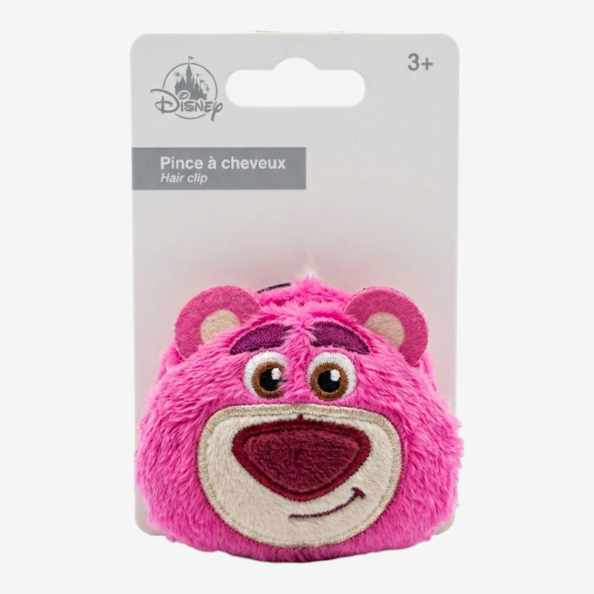Once Upon Magic Disney Lotso Huggin' Bear plush hair clip in fuzzy pink with embroidered face details.