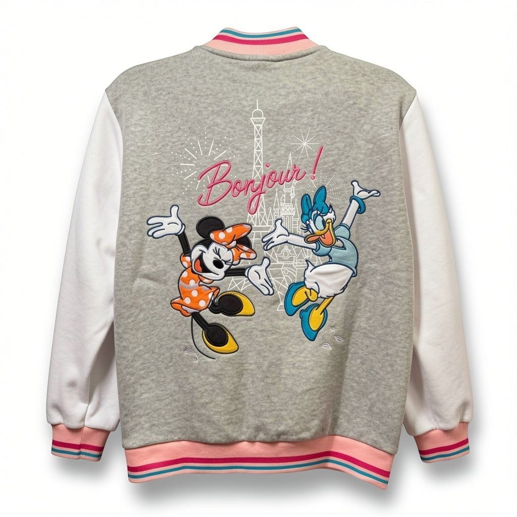 Once Upon Magic grey and white teddy jacket with Minnie Mouse and Daisy Duck in front of Eiffel Tower and "Bonjour!" text.