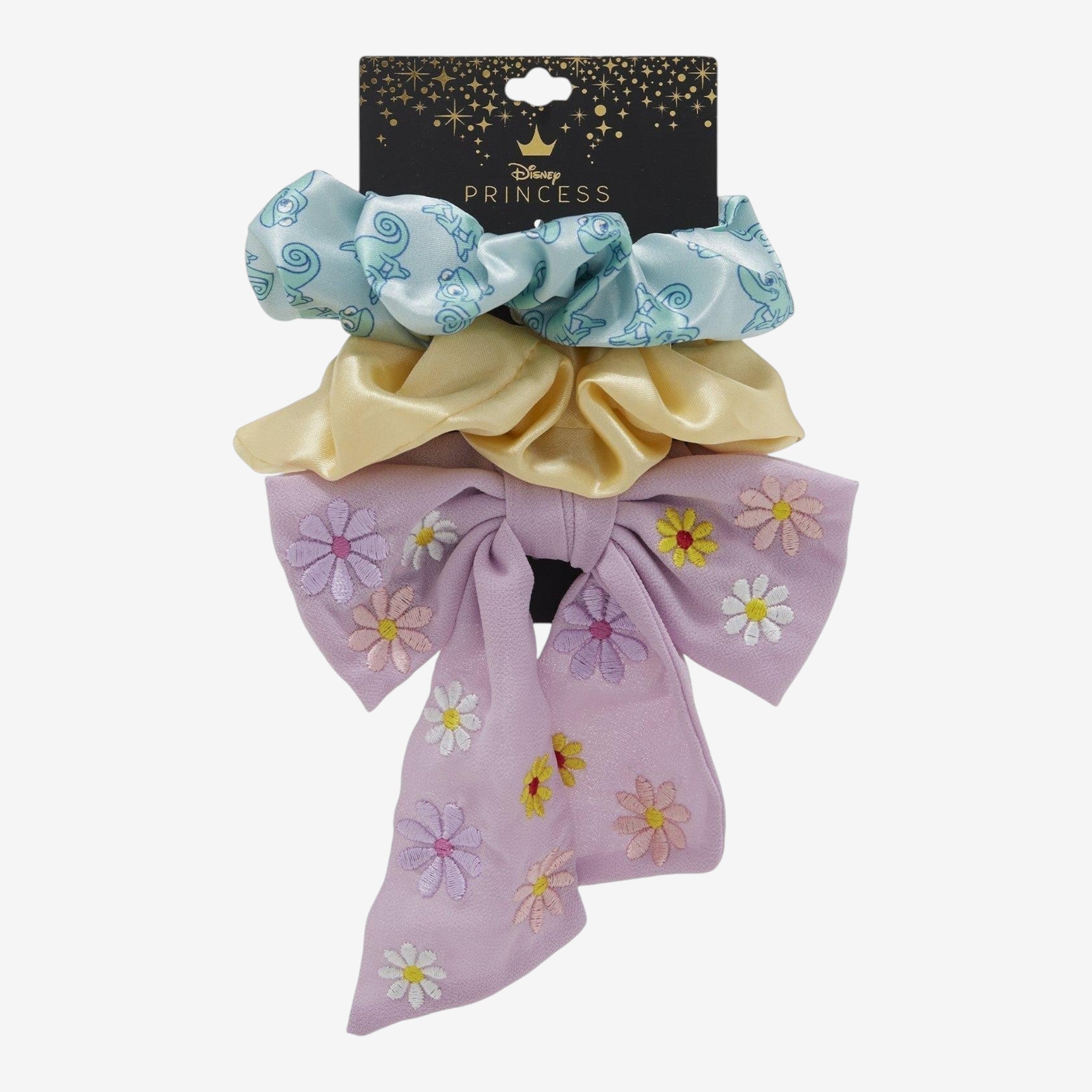 Once Upon Magic Disney Princess hair set: blue scrunchie with Pascal, yellow scrunchie, and lavender bow with embroidered flowers.